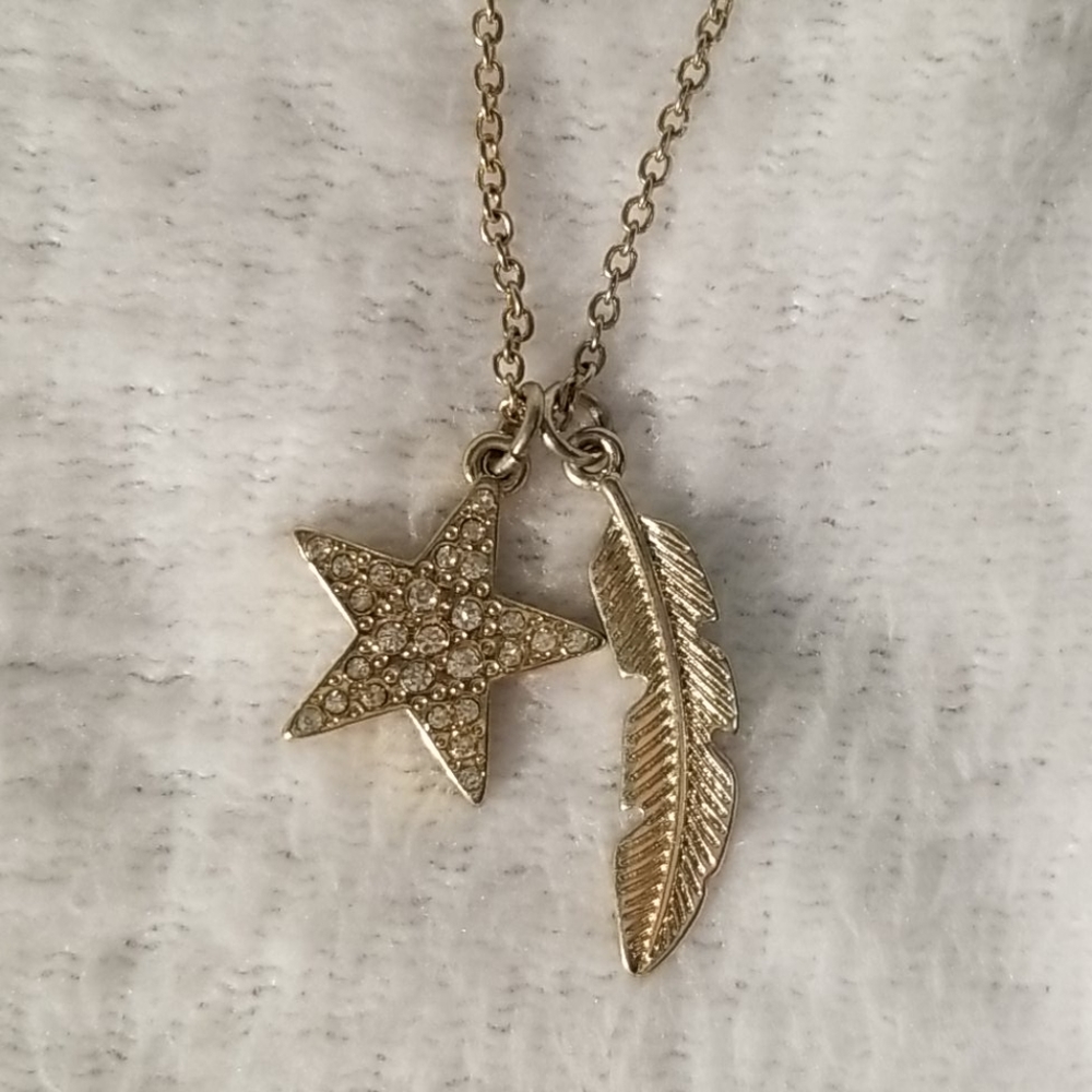 Gold star and feather necklace